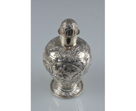 A 19TH CENTURY DUTCH SILVER TEA CADDY, of baluster form, domed pull off cover, foliate embossed and fluted decoration, the ba