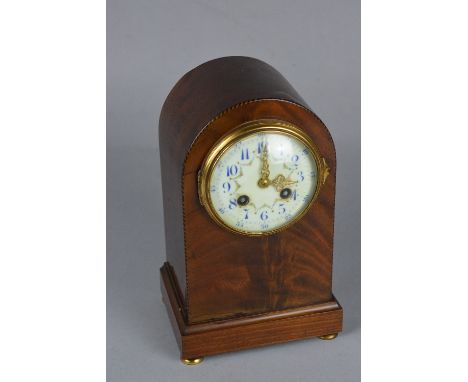 AN EARLY 20TH CENTURY MAHOGANY CASED MANTEL CLOCK, dome top, French movement, enamel dial painted with Arabic numerals and fl