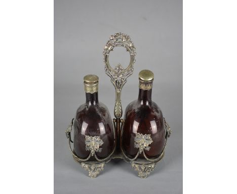 A VICTORIAN SILVER PLATED DECANTER FRAME, cast central carrying handle, open rope twist and fruiting vine sides, fitted with 