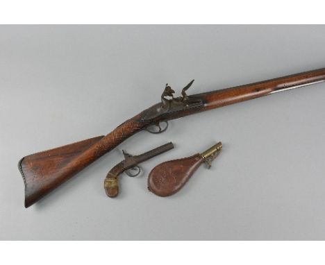 A FLINTLOCK SHOTGUN, fitted with a 14 bore 36 1/2'' barrel with a lock marked T. Richards, its rounded surface banana shaped 