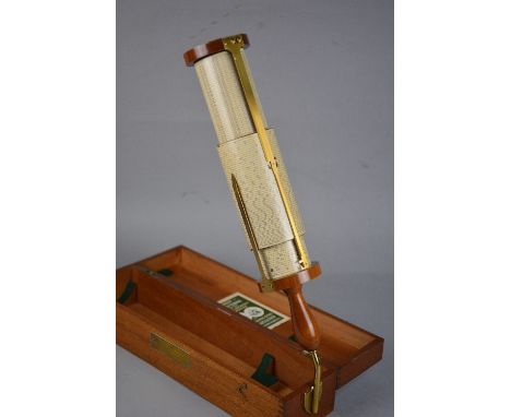 A CASED STANLEY FULLER CALCULATOR WITH SCALE OF SINES & LOGS, turned wooden handle and brass stand, comes with instruction ma