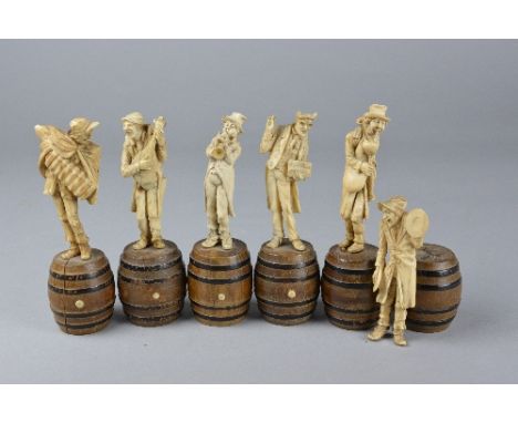 A SET OF SIX 19TH CENTURY FRENCH IVORY FIGURES MOULDED AS MUSICIANS, standing atop stained wooden coopered effect barrels, co