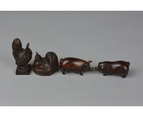 A CARVED WOODEN NETSUKE IN THE FORM OF A SEATED COCKEREL, height approximately 4cm x length 4.5cm, together with three carved
