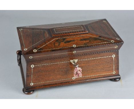 AN EARLY VICTORIAN ROSEWOOD AND MOTHER OF PEARL INLAID SARCOPHAGUS TEA CADDY, the interior fitted with a pair of rosewood and