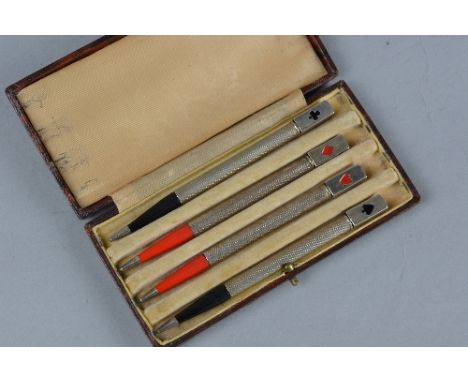 A CASED SET OF FOUR STERLING SILVER BRIDGE PENCILS, the square finials enamelled with card suit to one side, stamped sterling