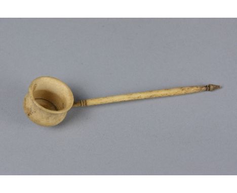 AN EARLY 19TH CENTURY BONE TODDY LADLE, cauldron shaped bowl on a turned handle, length approximately 16cm