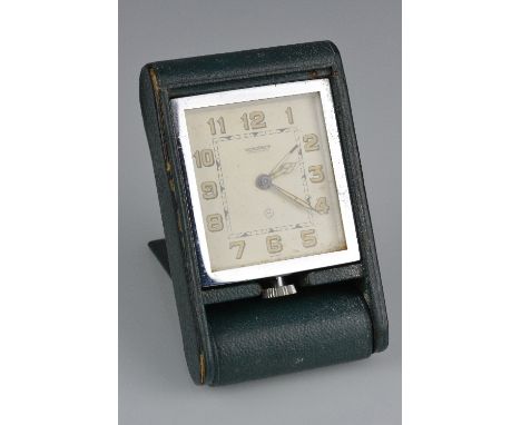 A 1930'S JAEGER LE COULTRE TRAVEL ALARM CLOCK, in green leather case