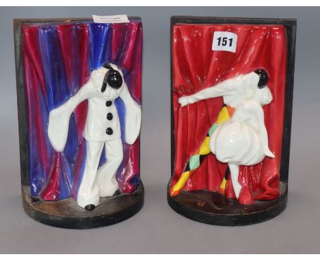 A pair of Royal Worcester Pierrot and Harlequin and Columbine bookends, designed by Doris Lindner in 1931, discontinued in 19