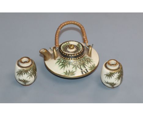 A Japanese Satsuma pottery miniature tea pot and two vases Provenance - The owner and her family lived in Singapore in the la