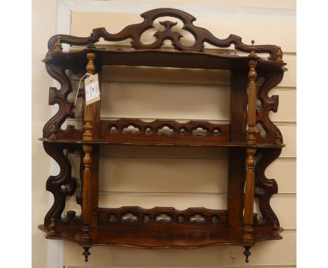 A mahogany three tier wall shelf W.46cm