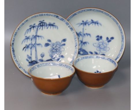 A pair of Nanking Cargo blue and white tea bowls and saucers