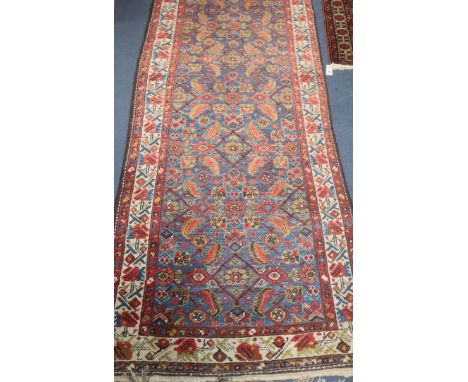 An early 20th century Caucasian blue ground runner- 5m x 1m