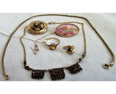 A Victorian hear-shaped pendant, set with a cabouchon garnet and vacant glazed panel to reverse, a Victorian mourning brooch 