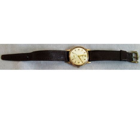 A gentleman's 9ct gold Longines wristwatch, the circular champagne dial with baton numerals and subsidiary seconds at six o'c