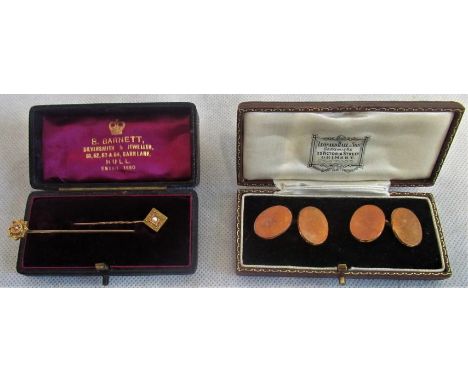 A pair of plain oval 9ct gold cufflinks cased, together with two stick pins. Condition Report: 9ct - 10 grams.