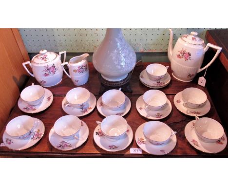 A Limoges tea service, consisting: teapot, milk jug, large two handled lidded bowl and 11 cups &amp; saucers, decorated with 