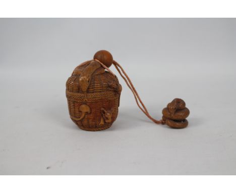 A single case carved wood inro in the form of a basket with mice and a snake, along with a snake form netsuke and wooden bead