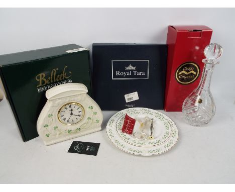 Lot to include a boxed Belleek Daisy mantel clock, boxed Mayo Crystal decanter and a boxed Royal Tara two tier cake plate. [3