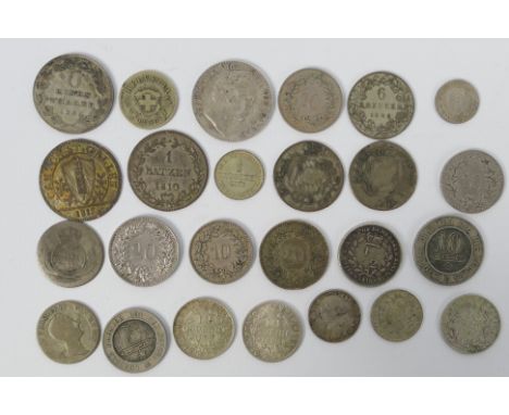 A collection of continental silver and white metal coins to include George III Essequibo &amp; Demerary 1/2 Guilder 1816, fou