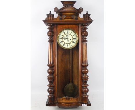 A Vienna-style weight-driven striking wall clock by Gustav Becker, walnut case with turned and applied decoration, opening gl