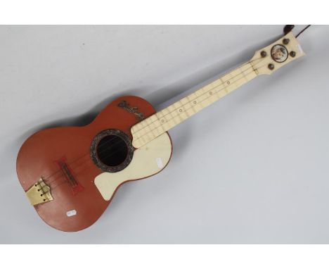 A Selcol Elvis Presley toy guitar, approximately 81 cm (l)