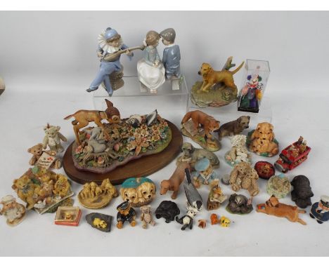 Lot to include two Nao figures / groups, a collection of animal figures and an Arden Sculptures Bambi tableau on wooden base