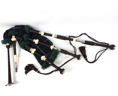 A set of Sinclair bagpipes with ivory and white metal mounts c.1957. Comprising turned African blackwood with ivory and unmar