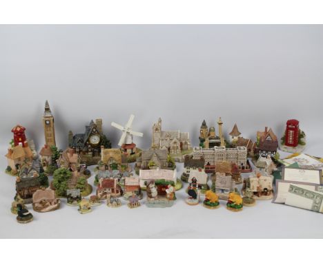 A collection of Lilliput Lane and similar models to include Big Ben, Buckingham Palace, Chiltern Mill, Bookshop, St Lawrence 