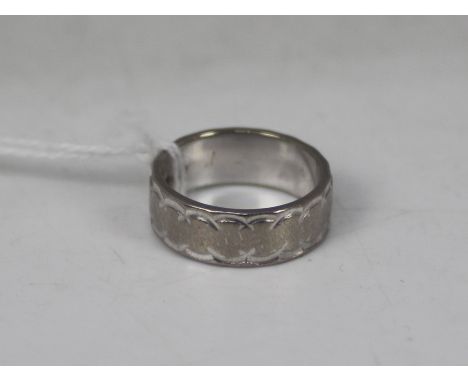 An 18ct white gold band ring, size K, approximately 6.8 grams all in.