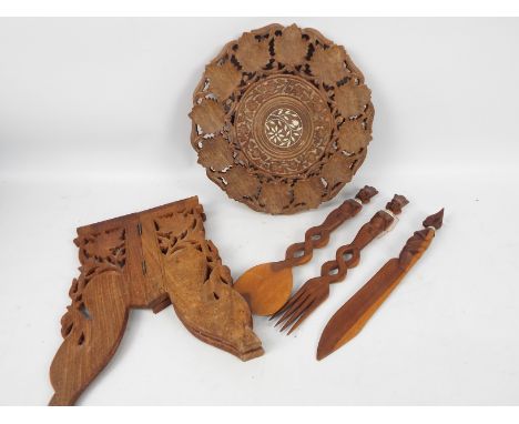 Ethnographica - A carved wood folding table with foliate decoration, approximately 32 cm x 31 cm and other.