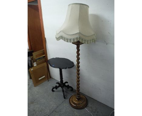 A late Victorian ebonized pedestal wine table, 30 high, 25 wide and a mid 20th century beech barley twist standard lamp