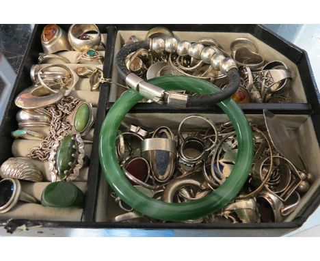 A quantity of silver arts & crafts style rings and a jade bangle