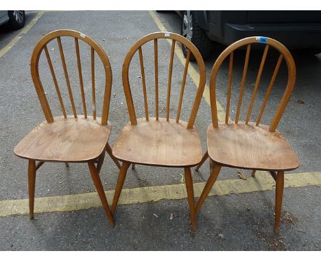 Three Ercol beech and elm stick back chairs