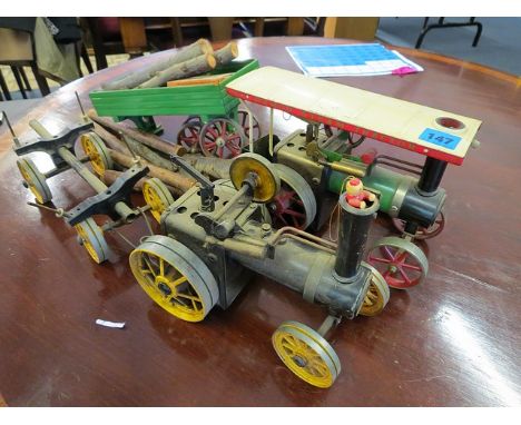 A Mamod steam engine, trailer and companion