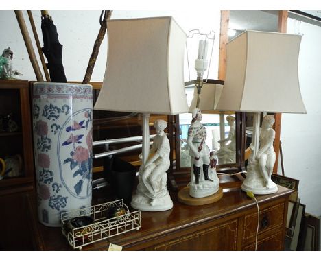 A mixed lot to include, walking sticks, a mahogany toilet mirror, porcelain stick stand and three pottery table lamps