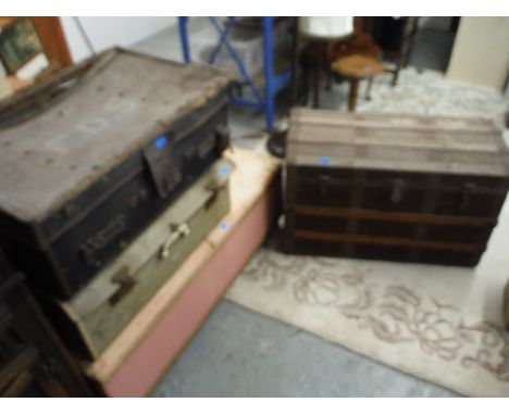 Small furniture to include a pink painted woven ottoman, two suitcases and a canvas trunk