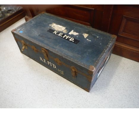 A blue trunk with a paper lined tray interior