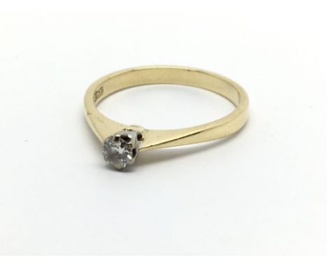 An 18carat gold ring set with a solitaire diamond approximately 0.10 of a carat ring size K-L