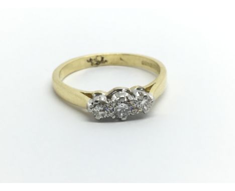 An 18ct gold three stone diamond ring, approx .32ct, approx 2.8g and approx size K.