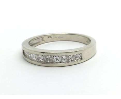 A 9ct white gold half eternity diamond ring set with princess cut diamonds, approx 1/2ct, approx 2.6g and approx size N-O.