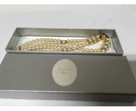 A Christian Dior simulated double row pearl necklace in a fitted box.