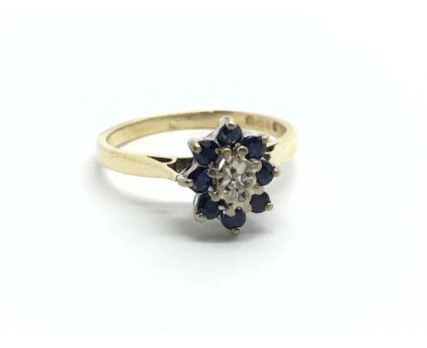 An 18ct gold diamond and sapphire cluster ring, approx 2.6g and approx size K.