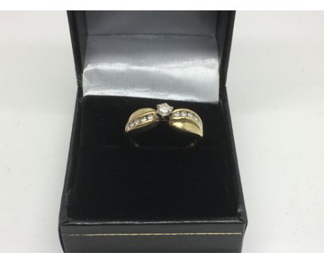 A 14ct diamond solitaire ring with a row of ten diamonds, approx 3.2g and approx size N-O.