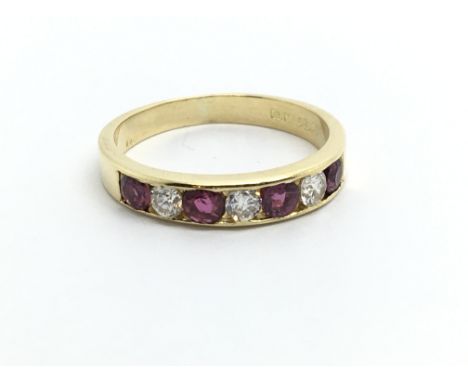 An 18ct gold half eternity ring set with alternating rubies and diamonds, approx 2.5g and approx size J-K.