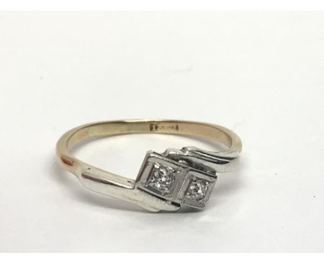 An 18ct gold ring set with two diamonds, approx 2.7g and approx size Q-R.