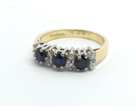 An 18ct gold sapphire and diamond ring, approx 3.1g and approx size J.