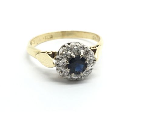 An 18ct gold sapphire and diamond cluster ring, approx 3.6g and approx size N-O.