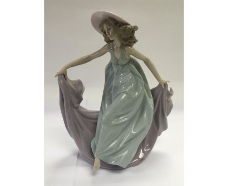 A Lladro figure of a girl in a dancing pose, approx 22cm.