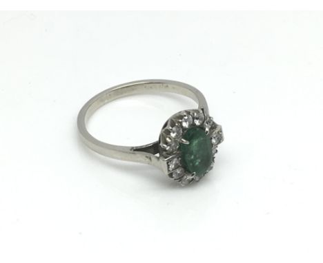 An unmarked emerald and diamond ring, approx 3.3g and approx size Q.