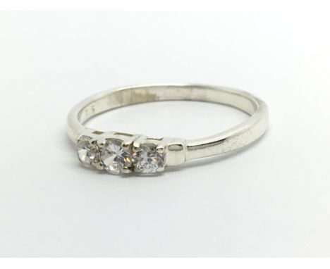 A 9ct white gold three stone diamond ring, approx .25ct, approx 2g and approx size R.